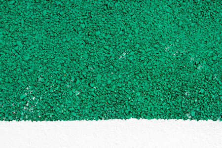 green road surface texture background and white painted lineの写真素材
