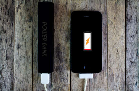 BUNG KAN, THAILAND - AUGUST 22, 2015: iphone is charging with power bank