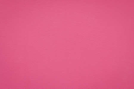 pink cement painted wall texture backgroundの写真素材