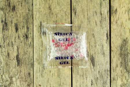 silica gel in plastic bag on wood plankの写真素材