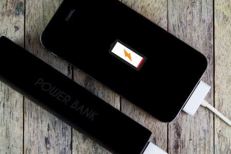 smart phone is charging with power bankの写真素材