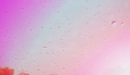 rain drops on front car glass, color abstract background