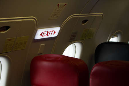 emergency exit sign on airplane, emergency doorの写真素材