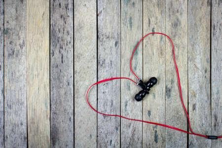 earphones put on wood plank,valentine backgroundの写真素材