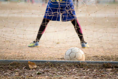 old football in goal, have a score
