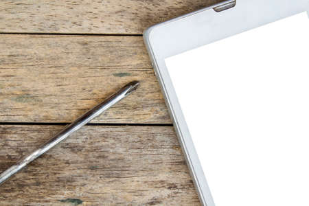 smart phone and screwdriver for repair,  top view, white screenの写真素材