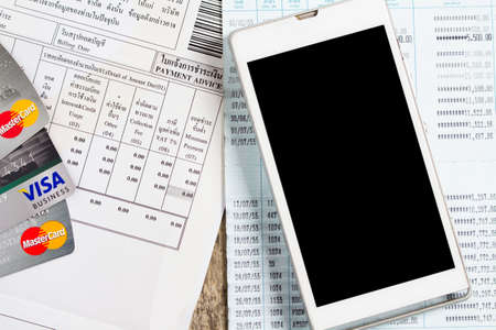 BUNGKAN, THAILAND - NOVEMBER 10, 2015: smart phone and billing and credit card on the table, payment...