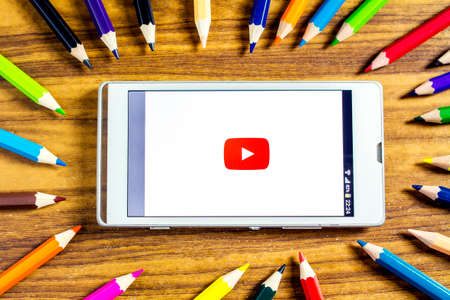 BUNGKAN, THAILAND - NOVEMBER 10, 2015: new youtube logo on smart phone with color pencil around