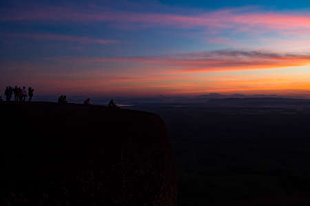 silhouette group of young people waiting sunriseの写真素材