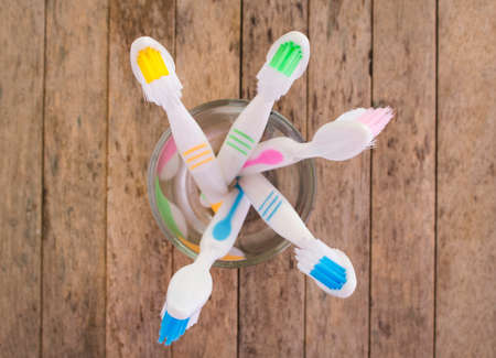 toothbrushes on wood plank background, soft focused, top viewの写真素材