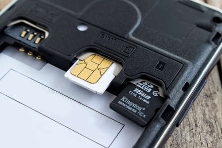 BUNG KAN, THAILAND - APRIL 04, 2016: sim card and micro sd card in slot of smart phone, soft focusedのeditorial素材