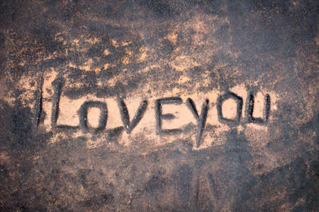 human painted i love you to surface of stone, dark tonedの写真素材