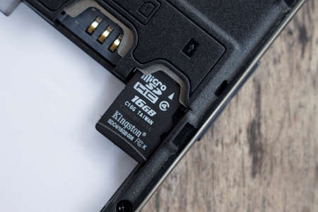 BUNG KAN, THAILAND - APRIL 04, 2016: micro sd card on top of smart phone, soft focusedのeditorial素材