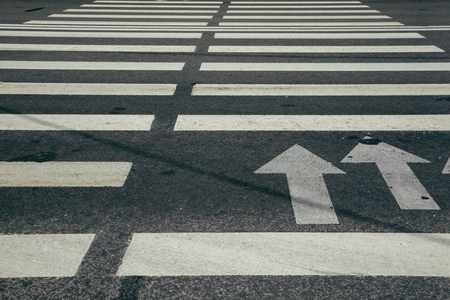 crosswalk perspective view white on the roadの写真素材