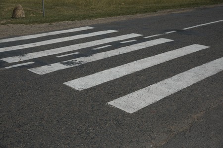 pedestrian crossing without people and cars in the woods close upの写真素材