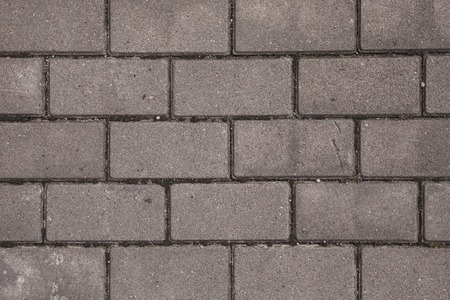 Granite cobble stone pavement background texture.