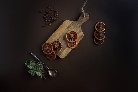 cut dried orange slices on a wooden boardの写真素材