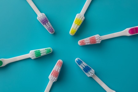 Toothbrushes in the form of a star on a blue backgroundの写真素材