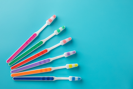 Toothbrushes on blue backgroundの写真素材