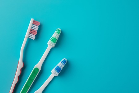 Toothbrushes on blue backgroundの写真素材