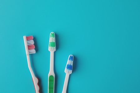 Toothbrushes on blue backgroundの写真素材