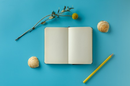 Top view flat lay of workspace . blue color paper background, minimal style.の写真素材