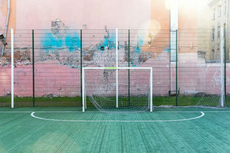 empty old playing football field in the cityの写真素材