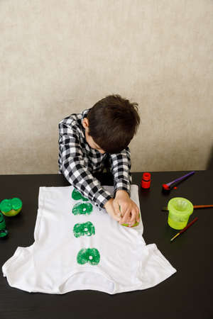 Printing of stamps. handmade with an exclusive print on clothes. step-by-step instructionの写真素材