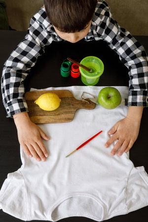 Printing of stamps. handmade with an exclusive print on clothes. step-by-step instructionの写真素材