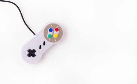 Gray retro joystick on a white background. Video game console GamePad on a white background. Top viewの写真素材