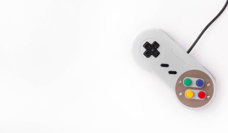 Gray retro joystick on a white background. Video game console GamePad on a white background. Copy spaceの写真素材