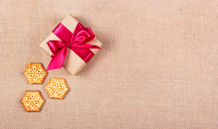 Cookie in the form of snowflakes and gift box. Festive concept. New Year's and Christmas. Copy spaceの写真素材