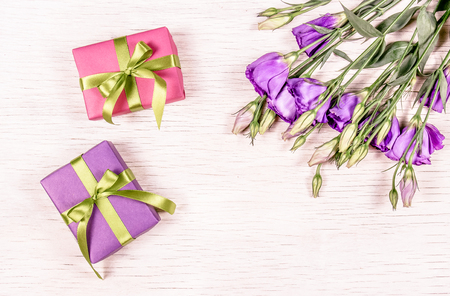 Small gift boxes and flowers. Gift on a white background. Copy spaceの写真素材