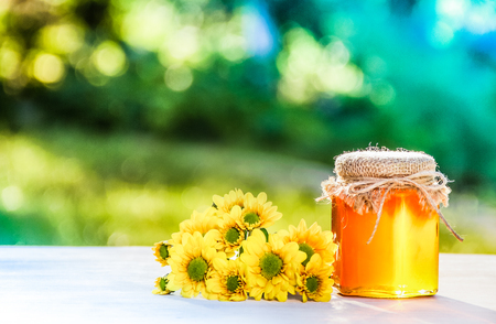 Natural organic honey and flowers. Grandma's gift. Wild honey. Spring concept. Natural medicine. Seasonal concept. Copy spaceの写真素材