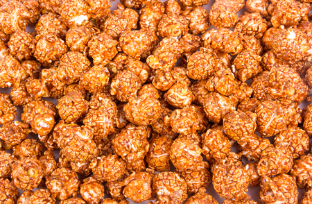 Chocolate creamy popcorn. Backgrounds and textures. Top viewの写真素材