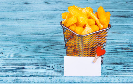 Golden crispy chips in an iron basket. Copy space.の写真素材