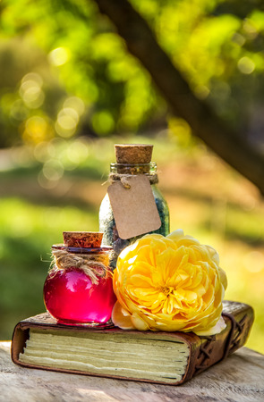 Essential rose oil and salt. Spa set. Spa concept. Love drink. Love potionの写真素材