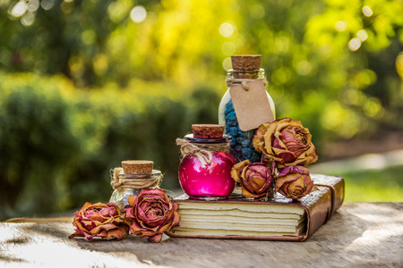 Essential oil, aromatic salt and dried flowers. Essential rose oil and salt. Spa set. Spa concept.の写真素材