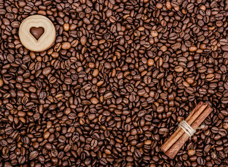 Roasted coffee beans. Coffee, cinnamon and biscuits. Coffee beans and cinnamon. Copy spaceの写真素材