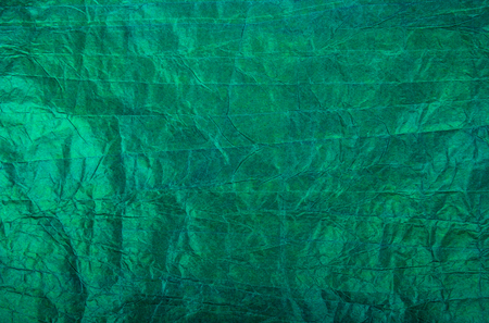 Green paper background. Crumpled paper background. Crumpled paper texture. Copy spaceの写真素材