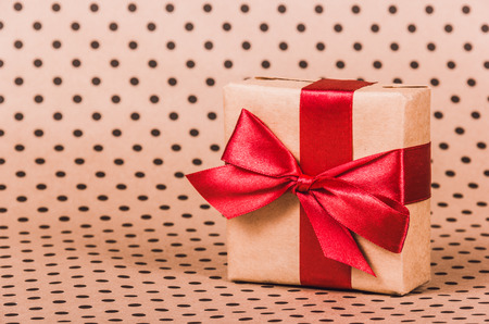 Gift box with a red bow. Gift with red ribbon. Copy spaceの写真素材