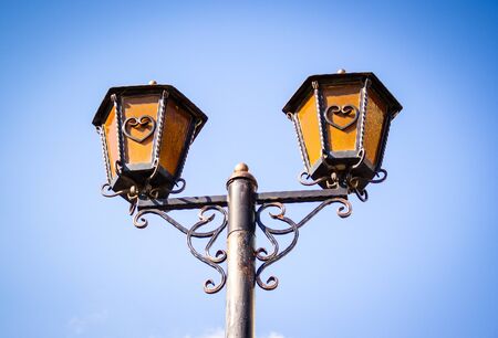 Old street lamp. Vintage street lamp on sky background. Romantic lanternの写真素材