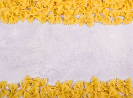 Italian pasta farfalle copy space. Pasta on gray backgroundの写真素材