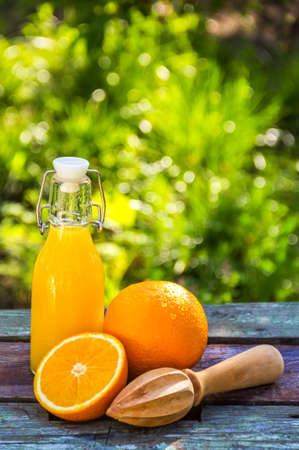 Juicy orange and cold lemonade. Orange juice bottleの写真素材