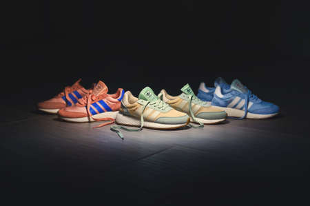 Stylish Adidas Iniki running shoes, sneakers, trainers in 3 different colors. Krasnoyarsk, Russia - July 6, 2017のeditorial素材