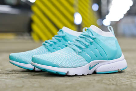 Hyper Turquoise Nike Air Presto running shoes, sneakers, trainers close up view, shot on abstract urban background at underground parking area. Krasnoyarsk, Russia - March 22, 2017のeditorial素材