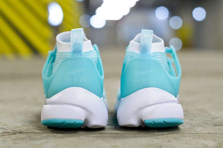 Hyper Turquoise Nike Air Presto running shoes, sneakers, trainers close up view, shot on abstract urban background at underground parking area. Krasnoyarsk, Russia - March 22, 2017のeditorial素材