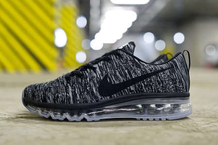 Nike Flyknit Air Max running shoes, sneakers, trainers close up view, shot on abstract urban background at underground parking area. Krasnoyarsk, Russia - March 22, 2017のeditorial素材