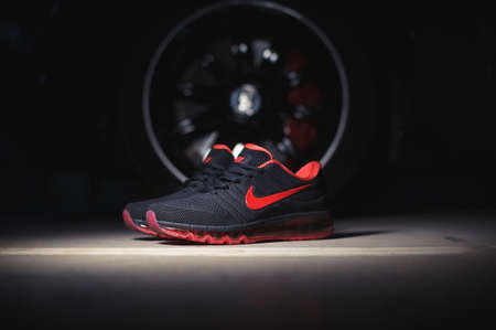 Perfect Nike Air Max 2017 sport shoes shot near the Mercedez Benz car on dark background. Sport and casual footwear concept. Krasnoyarsk, Russia - January 10, 2018のeditorial素材