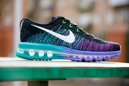 Colorful Nike Flyknit Air Max running shoes, sneakers, trainers close up view, shot on abstract background. Sport and casual footwear concept. Krasnoyarsk, Russia - Februsry 14, 2015のeditorial素材